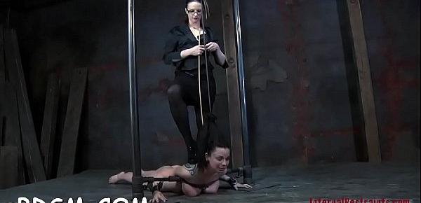  Handcuffed up beauties get their pussy fucked by torturer